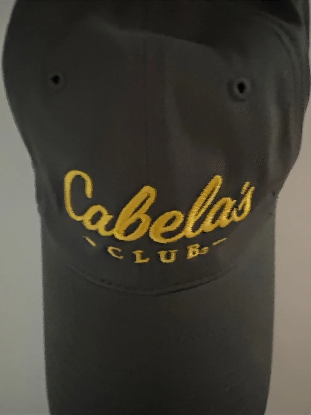 Cabela's Black Baseball Cap with Yellow Script Logo